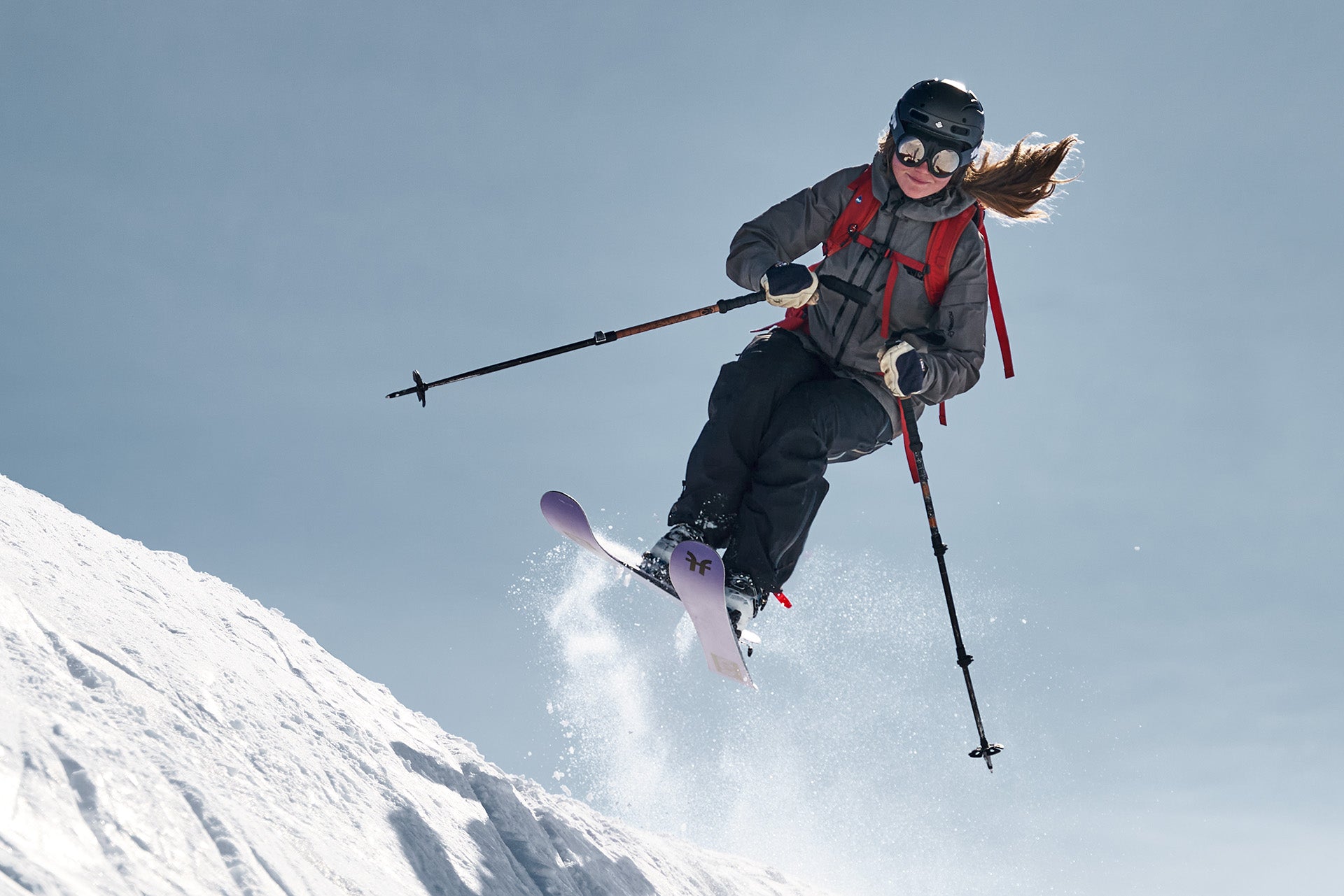 Female skier in Fluga Sports ski  goggles.goggles jumping